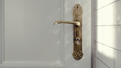 batch_kaboompics_Antique gold plated door handle