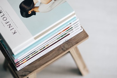 kaboompics_Stack of magazines on the wooden stool